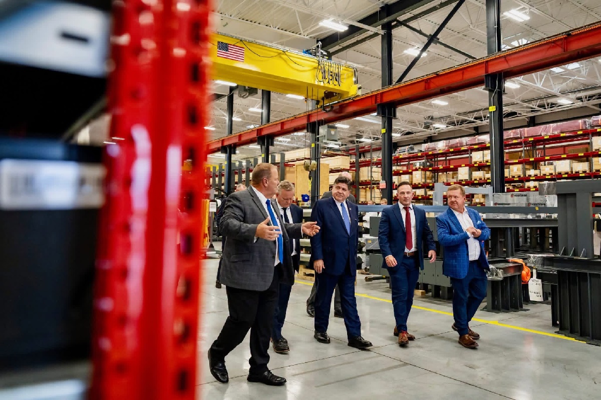 State Senator Patrick Joyce speaks with Governor JB Pritzker and others at Voortman's new facility in Monee