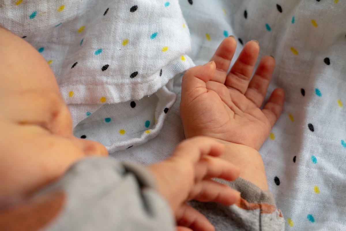 Midwife baby hand graphic