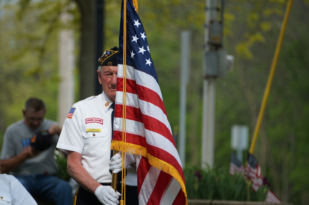 Veteran holding flag 2022